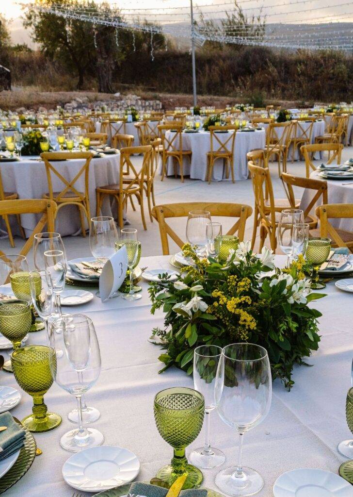 Elegant Wedding Reception Setup at La Esperanza Granada – Luxury Wedding Venue in Spain Outdoor wedding reception setup at La Esperanza Granada, one of the best places to get married in Spain, featuring elegant tables with floral centerpieces, crystal glassware, and Andalusian countryside views.