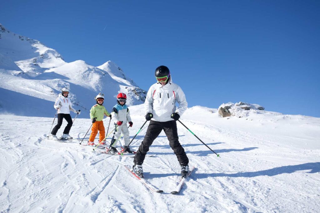 Family skiing in Spain, taking English-language ski lessons at the Sierra Nevada Ski Resort in Granada