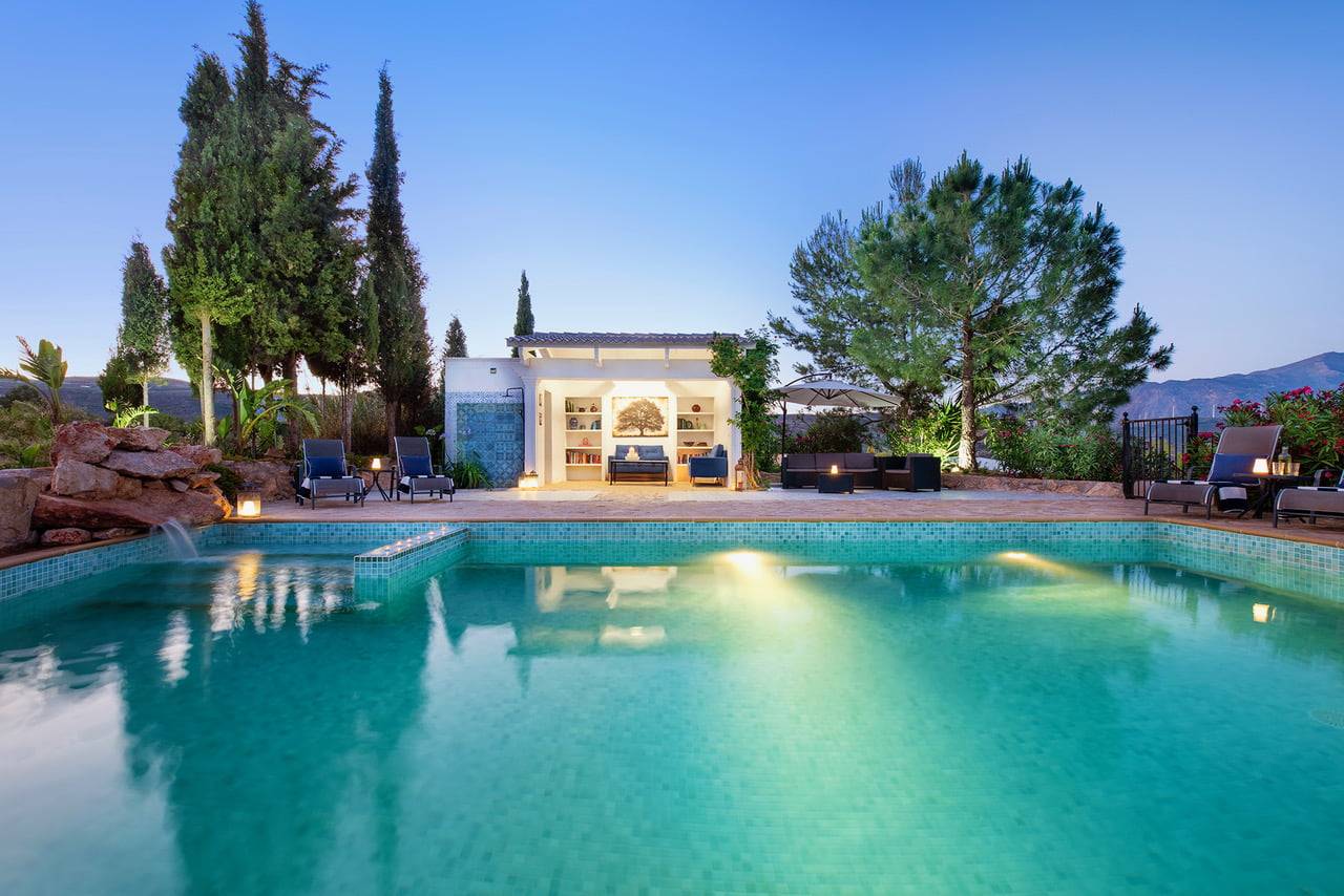 Swimming Pool at La Esperanza Granada Luxury Hacienda and Private Villa in Andalusia, Spain The panoramic swimming pool of La Esperanza Granada Luxury Hacienda and Private Villa in Granada, Spain, with a view of the mountains of Andalusia