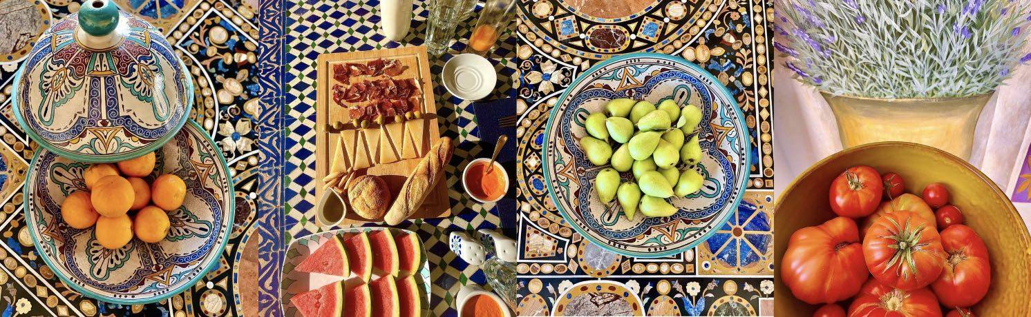 Traditional Spanish breakfast at La Esperanza Granada — a luxury villa and award-winning hacienda in Andalucía. Colorful Andalusian table with local fruits, bread, jamón, cheese, and homemade dishes served on hand-painted Moorish tiles, reflecting the villa’s authentic farm-to-table hospitality.